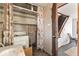 Laundry area with washer, sink, and open staircase at 2123 N F St, Elwood, IN 46036