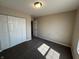 Neutral-toned bedroom offering a spacious closet and plush carpeting for comfort at 2402 Middle View Dr, Columbus, IN 47201