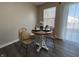 An eat-in dining area features a modern, wooden table with wicker chairs and lots of natural light at 2402 Middle View Dr, Columbus, IN 47201