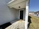 Close up of front door with wreath, sidelight, and the house number 2402 at 2402 Middle View Dr, Columbus, IN 47201
