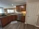 Spacious kitchen features wood cabinets, granite countertops and stainless steel appliances at 2402 Middle View Dr, Columbus, IN 47201