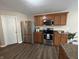 Modern kitchen features stainless steel appliances and wood cabinets at 2402 Middle View Dr, Columbus, IN 47201