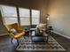 Inviting living room with large windows, stylish decor, and comfortable seating at 2402 Middle View Dr, Columbus, IN 47201