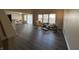 Open concept living room boasts wood floors, natural light, and space for dining at 2402 Middle View Dr, Columbus, IN 47201