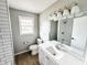 Updated bathroom with new fixtures, subway tile shower, and a bright vanity at 3008 Nichol Ave, Anderson, IN 46011