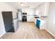 Eat-in kitchen featuring stainless steel appliances, sleek hardware, and vinyl flooring at 3008 Nichol Ave, Anderson, IN 46011