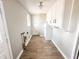 Utility room with laminate flooring, storage cabinets, and natural light at 3008 Nichol Ave, Anderson, IN 46011