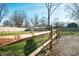Backyard featuring a wooden and wire fence, a gated entrance, and a grassy lawn at 3225 S Rybolt Ave, Indianapolis, IN 46221