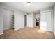 Bedroom with access to a bathroom, closet, and shelves on the wall at 3225 S Rybolt Ave, Indianapolis, IN 46221