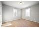 Bedroom featuring natural light, neutral colored walls, and carpet at 3225 S Rybolt Ave, Indianapolis, IN 46221