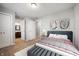 Cozy bedroom featuring neutral walls, carpet flooring, and an ensuite bathroom at 3225 S Rybolt Ave, Indianapolis, IN 46221