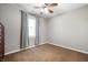 Bedroom featuring neutral carpet, a ceiling fan, a window and a spacious closet at 3225 S Rybolt Ave, Indianapolis, IN 46221