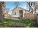 Charming home with a well-maintained lawn, gravel driveway and an American flag at 3225 S Rybolt Ave, Indianapolis, IN 46221