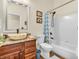 Updated bathroom with granite counters, vessel sink, and tiled shower-tub, ideal for modern comfort at 3559 Towne Dr, Carmel, IN 46032