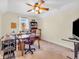 Versatile room with natural light, suitable as a bedroom or hobby area, and with ceiling fan at 3559 Towne Dr, Carmel, IN 46032