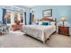 Comfortable bedroom with ample natural light, a large bed, and soft blue walls at 3559 Towne Dr, Carmel, IN 46032
