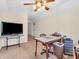 Bright bonus room featuring a ceiling fan, workspace and carpet flooring at 3559 Towne Dr, Carmel, IN 46032