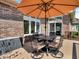 Outdoor deck featuring comfortable seating with a shady umbrella and privacy storage bin at 3559 Towne Dr, Carmel, IN 46032
