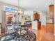 Dining area with a round table, seating, and a view of the kitchen and outdoor patio at 3559 Towne Dr, Carmel, IN 46032