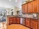 Beautiful kitchen area featuring a breakfast bar, stainless steel appliances and hardwood flooring, with easy access to dining at 3559 Towne Dr, Carmel, IN 46032