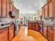 Well-equipped kitchen featuring wooden cabinetry, stainless steel appliances, and a breakfast bar for modern living at 3559 Towne Dr, Carmel, IN 46032