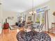 Living room with hardwood floors, a round rug, and a view of comfortable seating and natural light at 3559 Towne Dr, Carmel, IN 46032