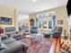 Comfortable living room with hardwood floors, plush seating, and a fireplace for cozy evenings at 3559 Towne Dr, Carmel, IN 46032