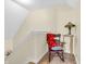 Cozy upstairs landing features a charming chair, decorative lamp, and carpeted steps, creating an inviting space at 3559 Towne Dr, Carmel, IN 46032