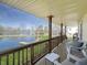 Relax on the covered porch with picturesque views of the tranquil waterfront at 3736 W South Wood Lake Dr, Columbus, IN 47201