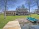 Beautiful backyard with access to the lake and a charming green pedal boat at 3736 W South Wood Lake Dr, Columbus, IN 47201