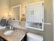 Bright bathroom with granite countertop and plenty of storage at 3736 W South Wood Lake Dr, Columbus, IN 47201