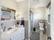 Well-lit bathroom with a vanity, mirror, and a separate shower at 3736 W South Wood Lake Dr, Columbus, IN 47201