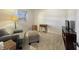 Minimalist bedroom featuring a cozy chair, ottoman, and television at 3736 W South Wood Lake Dr, Columbus, IN 47201