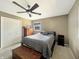 This bedroom has a ceiling fan and closet, offering a cozy retreat at 3736 W South Wood Lake Dr, Columbus, IN 47201