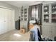Neutral colored bedroom with built in cabinets, carpet, and a window for natural light at 3736 W South Wood Lake Dr, Columbus, IN 47201