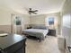 Bedroom with lots of light, ceiling fan, and neutral earth tone walls at 3736 W South Wood Lake Dr, Columbus, IN 47201