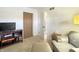Bright bedroom with hardwood floors, open closet, and a comfortable seating area at 3736 W South Wood Lake Dr, Columbus, IN 47201