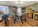 The dining room boasts hardwood floors, stylish furnishings, and natural light at 3736 W South Wood Lake Dr, Columbus, IN 47201