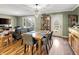 Charming dining area featuring a wooden table, seating for six, and elegant chandelier lighting at 3736 W South Wood Lake Dr, Columbus, IN 47201