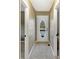 Hallway with neutral walls leading to a backyard view through a door at 3736 W South Wood Lake Dr, Columbus, IN 47201