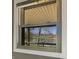 A picture window showcases the tranquil lake, creating a relaxing setting at 3736 W South Wood Lake Dr, Columbus, IN 47201