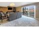 A basement living room with brick wall offers outdoor access with water view at 3736 W South Wood Lake Dr, Columbus, IN 47201