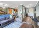 Open-concept living room with hardwood floors and a view into the kitchen at 3736 W South Wood Lake Dr, Columbus, IN 47201
