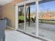 View of a lakeside patio with sliding glass doors and chairs for relaxing at 3736 W South Wood Lake Dr, Columbus, IN 47201