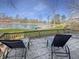 Relax on the patio with waterfront views and plenty of space for outdoor enjoyment at 3736 W South Wood Lake Dr, Columbus, IN 47201