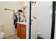 Bathroom boasting a vanity, mirror, and tiled shower with a black frame at 425 Conduitt Dr, Mooresville, IN 46158