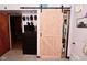 Bedroom with open closet and decorative sliding barn door at 425 Conduitt Dr, Mooresville, IN 46158