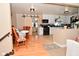 Open-concept kitchen with wooden accents, modern appliances, and ample counter space, perfect for cooking and entertaining at 425 Conduitt Dr, Mooresville, IN 46158