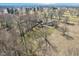 Aerial view of a single-Gathering home with a large lot surrounded by mature trees and open space at 4709 S County Road 500 E, Plainfield, IN 46168