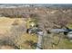 An aerial view of the house shows the spacious yard and surrounding trees at 4709 S County Road 500 E, Plainfield, IN 46168